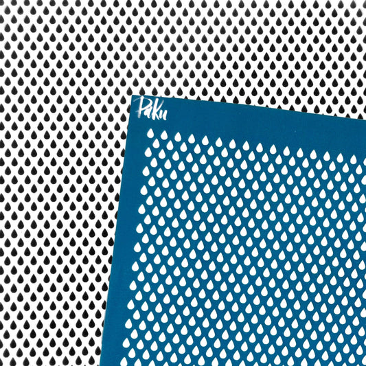 A blue silkscreen stencil sheet with a repeating teardrop-shaped cutout pattern, shown against a matching black-and-white perforated metal background. The brand name 'Paku' is printed in white near the top-left corner of the stencil.