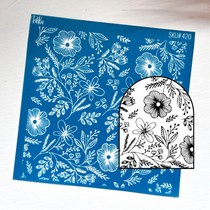 A blue rectangular sheet with white floral line art and the text 'Sku#420' is shown on a white background, alongside a black-and-white arched sample piece displaying the same floral pattern.