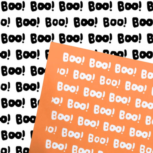 An orange silkscreen sheet of Halloween featuring the word 'Boo!' in white, shown diagonally over a white background patterned with black 'Boo!' text.