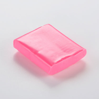 A vibrant fluorescent pink. Fuchsia from the Cernit Neon range of polymer clay. un-packaged 56g bar on a white background.