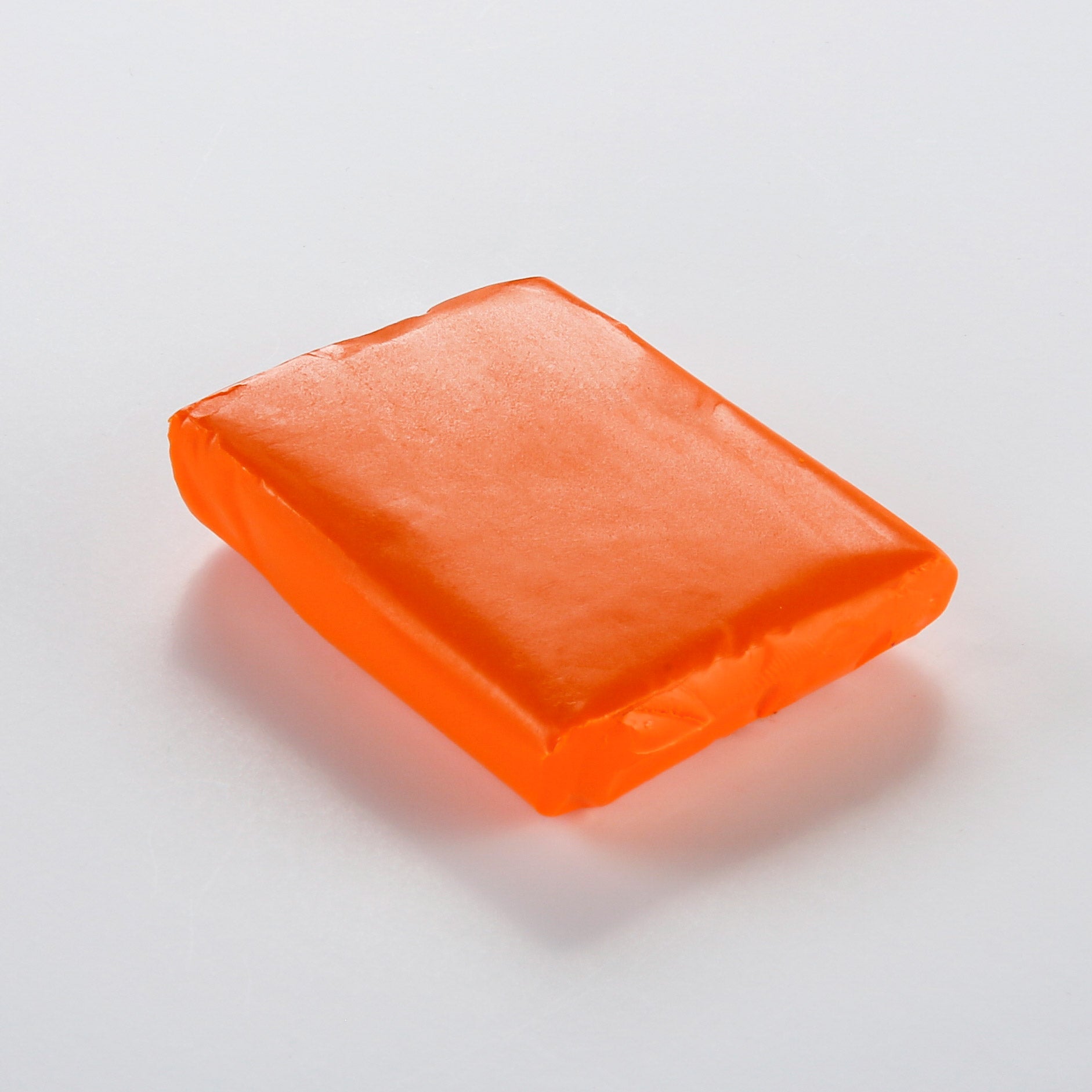 CERNIT Neon Light orange polymer clay not in packaging on a white background