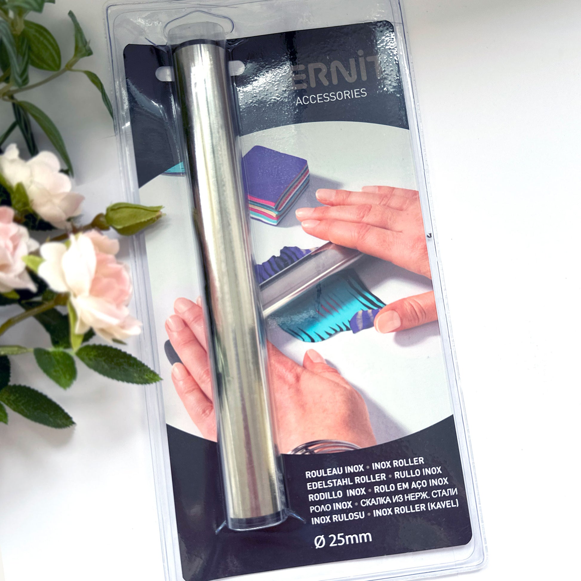 Metal roller in packaging with brand name Cernit on a white surface with flowers.
Cernit Rolling Pin | Stainless Steel - for polymer clay
