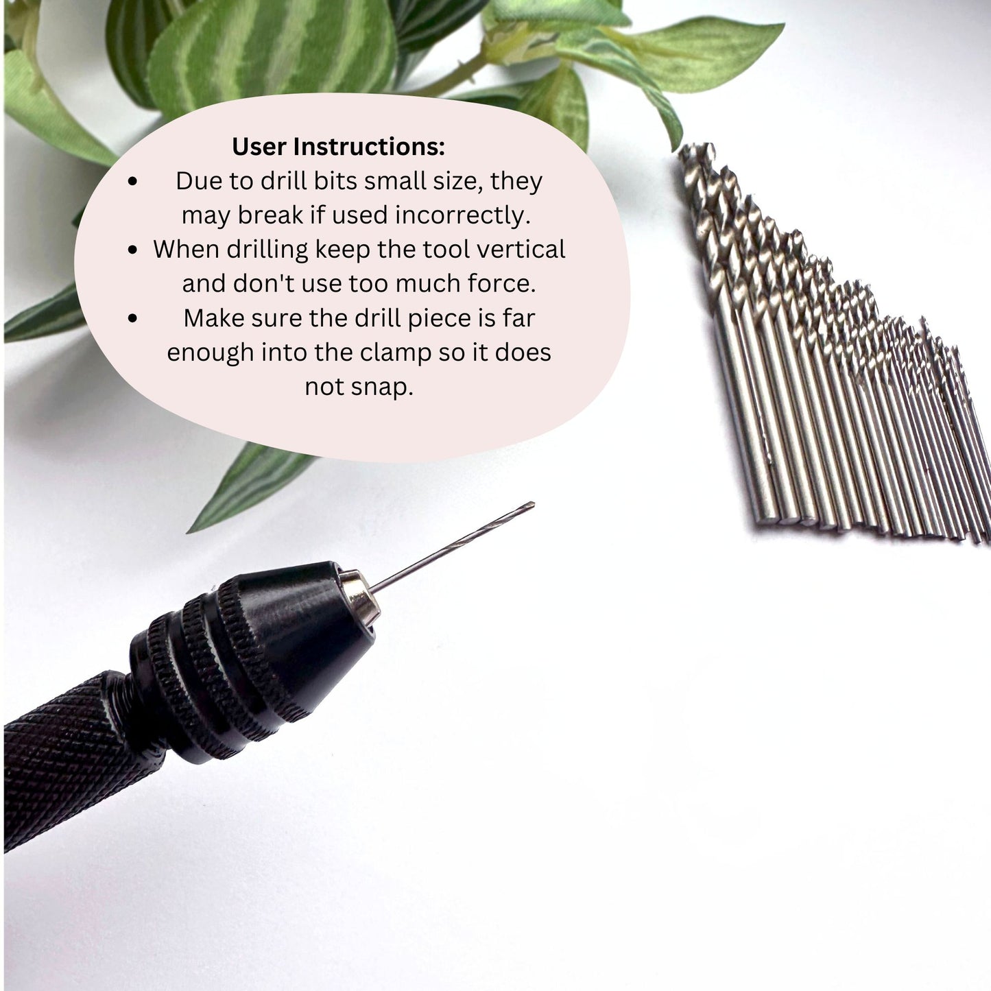 Small hand drill and bit set with user instructions on a white background