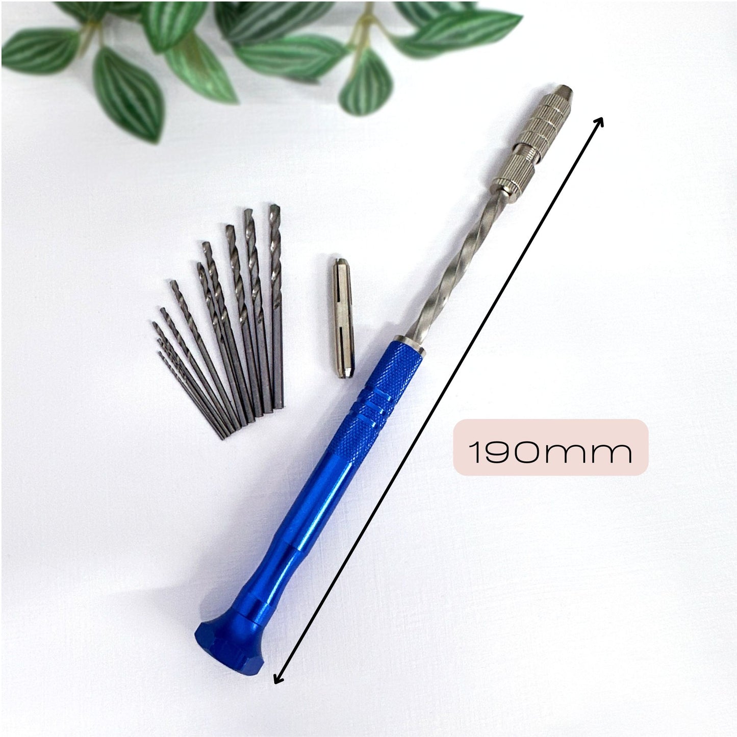 Drill bit set with a blue handle and metal drill bits on a white background