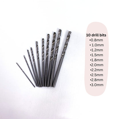 Set of 10 drill bits with size labels on a white background