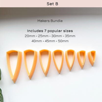 A set of seven orange plastic cookie cutters in different sizes arranged in a row on a white background, with text above reading 'Set B', 'Makers Bundle', and listing the included sizes from 20mm to 50mm.