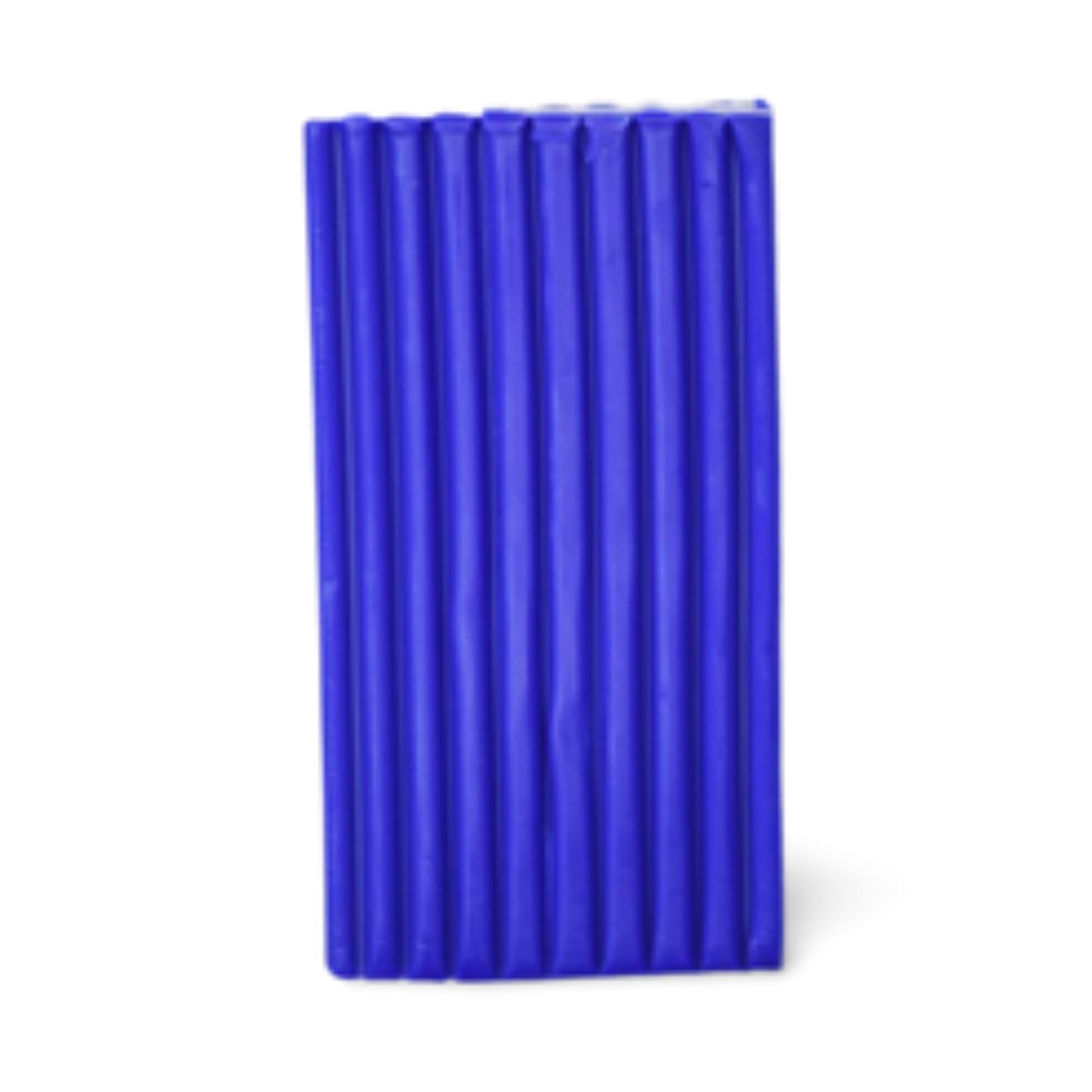 A block of ultramarine blue hue clay on a white background.