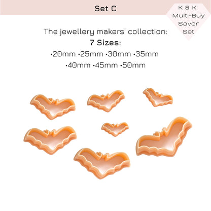 A set of bat-shaped cookie cutters in peach and orange tones, shown with text listing seven sizes and a 'K & K Multi-Buy Saver Set' label on a white background.