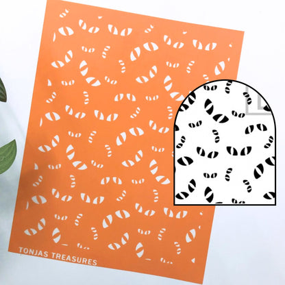 An orange rectangular stencil sheet shown on a white background with a smaller inset showing the black-and-white pattern through the stencil. The brand name 'TONJAS TREASURES' appears at the bottom left.