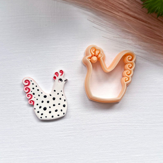 Chicken hen clay cutter, for arts and crafts. 
Size 35mm has been used in the product photo.
These cutters are designed for use in clay, polymer, metal, airdry, etc.
They can be used to cut, impression or texture clays.
