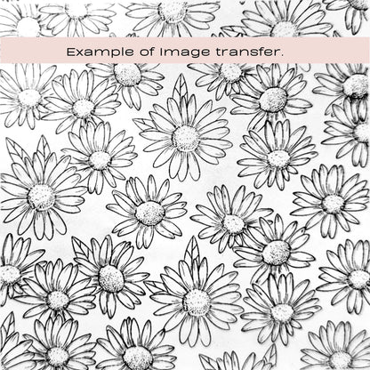 Pattern of black and white daisy flowers with a pink text box at the top saying example of image transfer. Silkscreen stencil to be used with polymer clay and cake making.