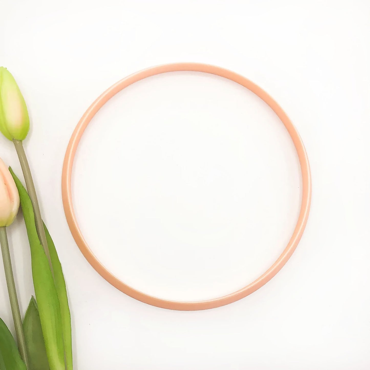 Large circle clay cutter for pottery, polymer and airdry clay. The circle is on a white background with flowers
