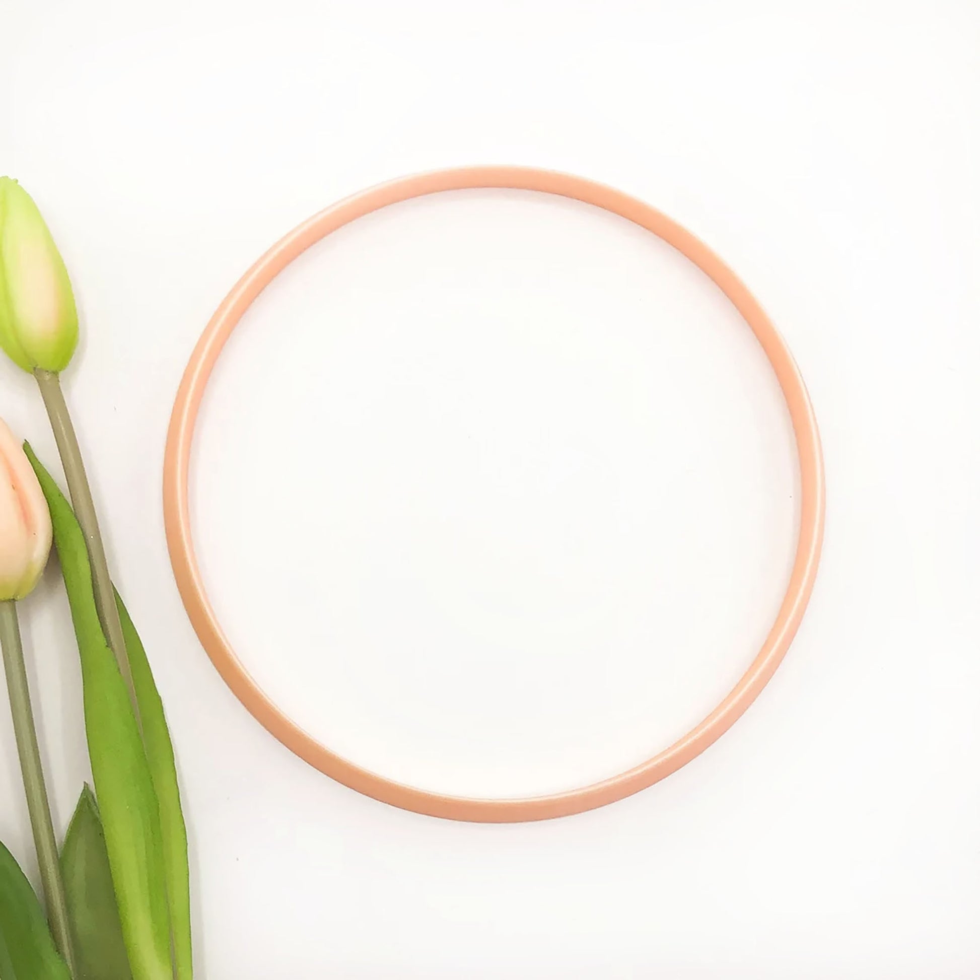 Large circle clay cutter for pottery, polymer and airdry clay. The circle is on a white background with flowers