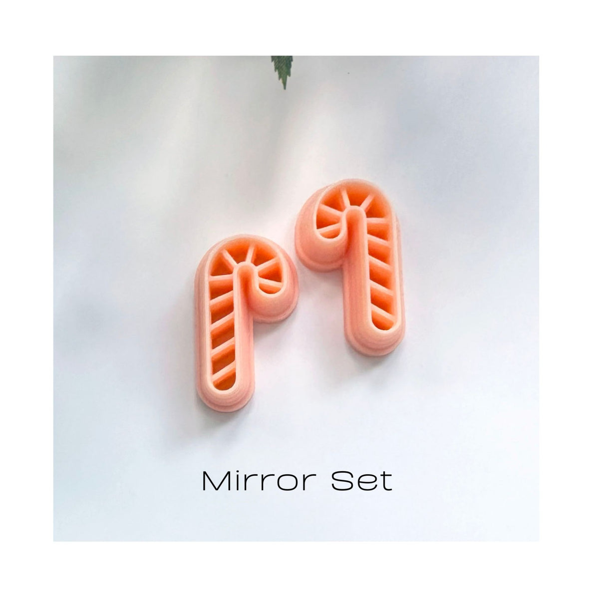 Two candy cane-shaped mirror clay cutters in a pale peach color, displayed on a white background with the text 'Mirror Set' underneath.