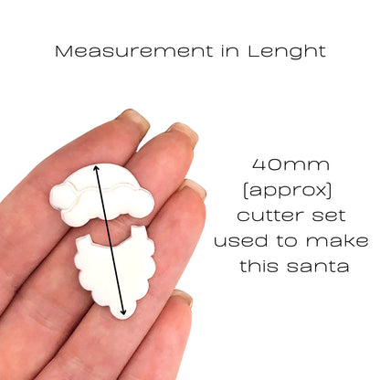 A hand holding two small white Santa-shaped cutout pieces with overlaid text reading 'Measurement in Lenght' and '40mm [approx] cutter set used to make this santa', on a plain white background.