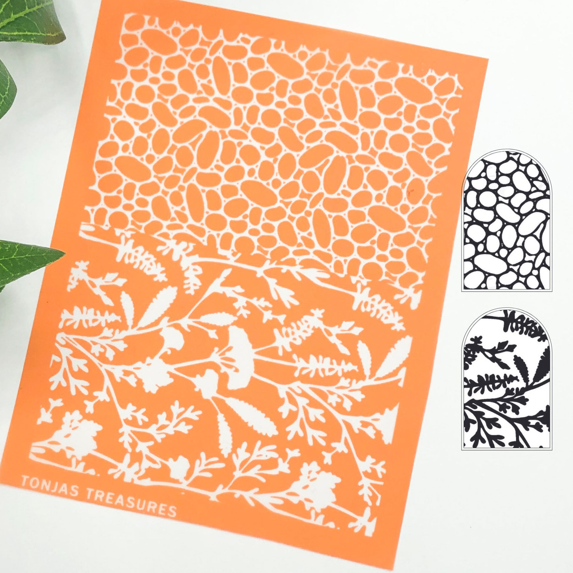River rock silkscreen stencil. Surface paint screen for polymer clay - picture shows the orange silkscreen with wildflowers and pebbles and a black & white image transfer of the design.