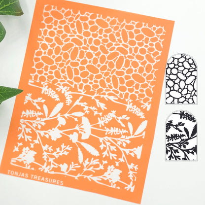 River rock silkscreen stencil. Surface paint screen for polymer clay - picture shows the orange silkscreen with wildflowers and pebbles and a black & white image transfer of the design.