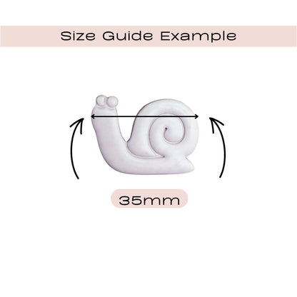 Size guide diagram showing a white snail-shaped item with a double-arrow width measurement labeled 35mm on a white background with a pale pink header reading 'Size Guide Example'.